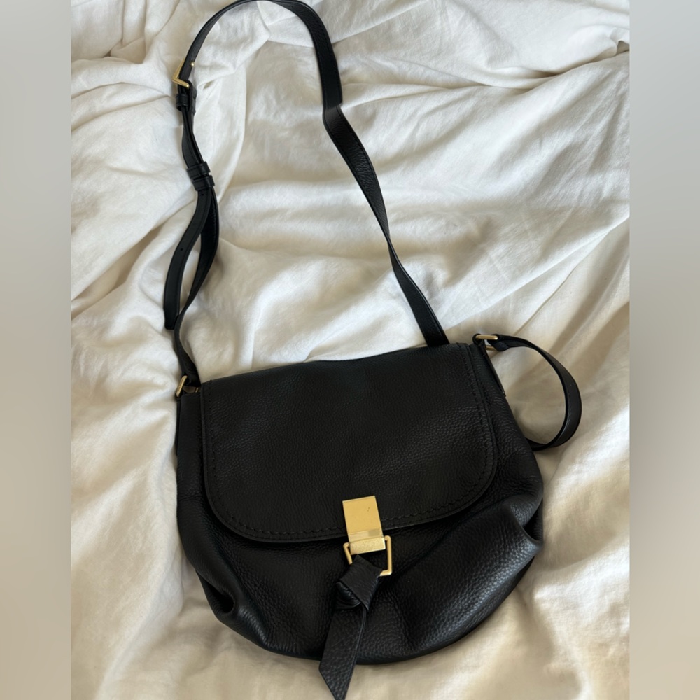 Vera Bradley Black leather crossbody bag.